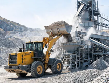Quarry loader feeding aggregate plant